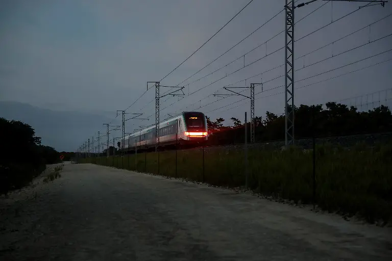 The-Maya-Train-passes-through-the-Mayan-community-of-Uh-May-in-Quintana-Roo-state-Mexico-November-12-2025-Mexico-s-1-500-km-Mayan-Train-was-launched-to-drive-development-in-the-country-s-impoverished-south-through-infrastructure-and-tourism-but-two-years-after-its-inauguration-it-is-struggling-financially-ticket-sales-cover-only-a-fraction-of-costs-hotels-remain-largely-empty-and-communities-along-the-route-say-poverty-persists-and-promised-benefits-have-yet-to-materialize-A-Reuters-review-of-census-data-and-interviews-with-residents-along-the-line-found-that-poverty-remains-widespread-and-well-paid-jobs-scarce-despite-the-project-REUTERS-Daniel-Becerril-SEARCH-BECERRIL-MAYA-TRAIN-FOR-THIS-STORY-SEARCH-WIDER-IMAGE-FOR-ALL-STORIES