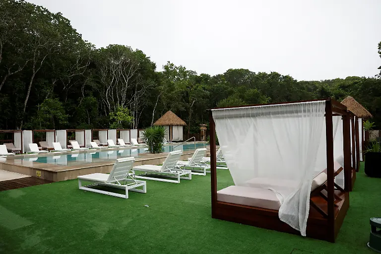 A-view-of-the-pool-area-at-the-Tren-Maya-Hotel-built-by-the-military-and-run-by-a-defense-ministry-agency-in-the-Calakmul-Biosphere-Reserve-in-Calakmul-Campeche-state-Mexico-November-13-2025-The-luxury-hotel-is-one-of-six-along-the-train-route-Government-data-reviewed-by-Reuters-shows-those-properties-averaged-monthly-occupancy-rates-between-5-and-24-most-of-last-year-Nicolas-Moreno-Jimenez-a-50-year-old-beekeeper-and-farmer-whose-family-was-displaced-decades-ago-when-the-government-created-the-Calakmul-reserve-a-UNESCO-World-Heritage-site-intended-to-protect-biodiversity-and-ruins-of-the-once-mighty-Mayan-empire-We-had-been-there-since-1980-said-Moreno-They-removed-us-in-1993-And-now-they-build-hotels-where-we-could-not-even-stay-REUTERS-Daniel-Becerril-SEARCH-BECERRIL-MAYA-TRAIN-FOR-THIS-STORY-SEARCH-WIDER-IMAGE-FOR-ALL-STORIES