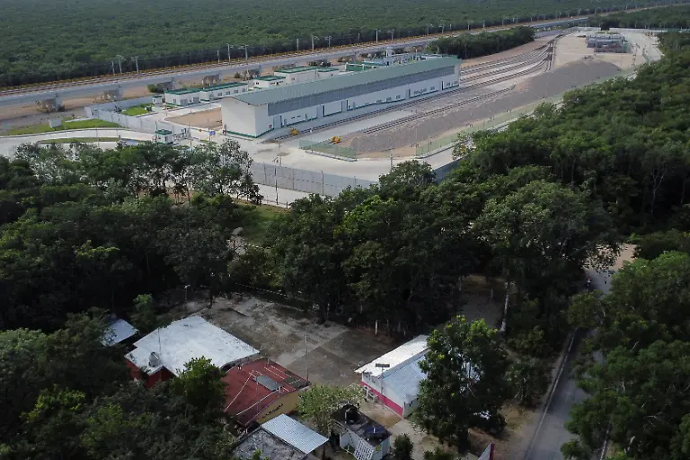 A-school-without-electricity-is-seen-below-near-a-fully-powered-Maya-Train-station-in-Vida-y-Esperanza-Quintana-Roo-state-Mexico-November-11-2025-Teacher-Lidia-Patricia-Chan-Us-has-spent-years-trying-to-get-power-connected-but-the-authorities-have-told-her-electricity-cannot-be-installed-until-the-land-beneath-the-school-has-formal-titles-a-red-tape-issue-common-for-rural-communal-plots-like-this-which-she-had-hoped-might-change-with-the-arrival-of-a-mega-project-that-the-government-had-vowed-would-spur-development-and-progress-At-the-beginning-when-the-project-came-along-we-were-happy-about-it-Chan-Us-said-Some-residents-sold-food-to-construction-workers-which-she-said-was-a-benefit-to-the-community-But-when-the-construction-ended-just-as-quickly-as-it-arrived-it-was-gone-REUTERS-Daniel-Becerril-SEARCH-BECERRIL-MAYA-TRAIN-FOR-THIS-STORY-SEARCH-WIDER-IMAGE-FOR-ALL-STORIES