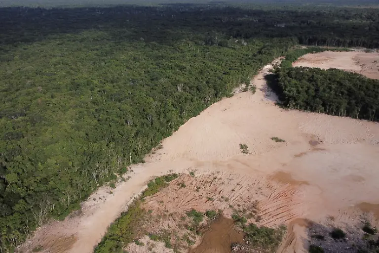 A-drone-view-shows-jungle-deforested-for-sascab-a-white-clay-used-in-construction-of-the-Mayan-Train-project-near-the-Mayan-community-of-Uh-May-where-railway-tracks-have-cut-access-between-residents-homes-and-their-crop-fields-Quintana-Roo-state-Mexico-November-16-2025-Mexico-s-1-500-km-Mayan-Train-was-launched-to-drive-development-in-the-country-s-impoverished-south-through-infrastructure-and-tourism-but-two-years-after-its-inauguration-it-is-struggling-financially-ticket-sales-cover-only-a-fraction-of-costs-hotels-remain-largely-empty-and-communities-along-the-route-say-poverty-persists-and-promised-benefits-have-yet-to-materialize-A-Reuters-review-of-census-data-and-interviews-with-residents-along-the-line-found-that-poverty-remains-widespread-and-well-paid-jobs-scarce-despite-the-project-REUTERS-Daniel-Becerril-SEARCH-BECERRIL-MAYA-TRAIN-FOR-THIS-STORY-SEARCH-WIDER-IMAGE-FOR-ALL-STORIES-REFILE-REMOVING-IN-CHETUMAL-FROM-LOCATION