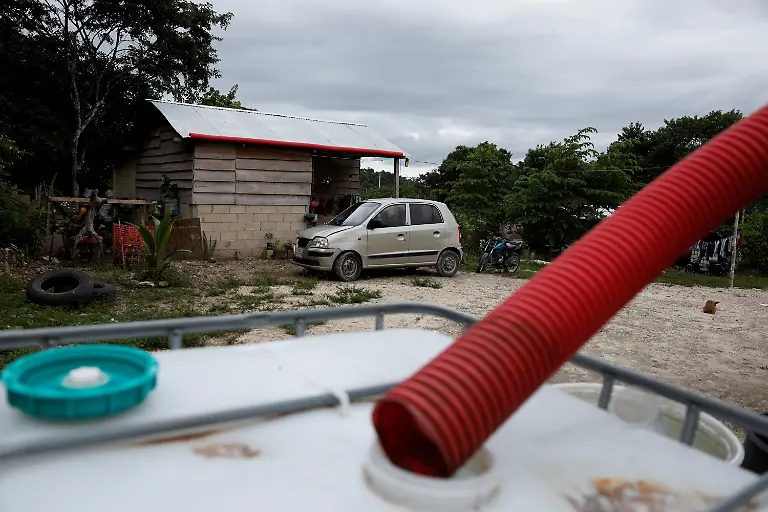 A-pipe-used-to-collect-rainwater-for-daily-use-because-of-a-lack-of-drinking-water-is-seen-at-a-house-in-Xpujil-Campeche-state-Mexico-November-14-2025-Mexico-s-1-500-km-Mayan-Train-was-launched-to-drive-development-in-the-country-s-impoverished-south-through-infrastructure-and-tourism-but-two-years-after-its-inauguration-it-is-struggling-financially-ticket-sales-cover-only-a-fraction-of-costs-hotels-remain-largely-empty-and-communities-along-the-route-say-poverty-persists-and-promised-benefits-have-yet-to-materialize-A-Reuters-review-of-census-data-and-interviews-with-residents-along-the-line-found-that-poverty-remains-widespread-and-well-paid-jobs-scarce-despite-the-project-REUTERS-Daniel-Becerril-SEARCH-BECERRIL-MAYA-TRAIN-FOR-THIS-STORY-SEARCH-WIDER-IMAGE-FOR-ALL-STORIES