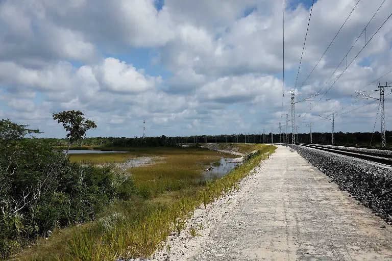 A-flooded-overpass-blocking-traffic-is-seen-near-the-Maya-community-of-Uh-May-where-farmers-have-struggled-to-reach-their-fields-since-construction-of-the-Maya-Train-in-Felipe-Carrillo-Puerto-Quintana-Roo-state-Mexico-November-16-2025-Mexico-s-1-500-km-Mayan-Train-was-launched-to-drive-development-in-the-country-s-impoverished-south-through-infrastructure-and-tourism-but-two-years-after-its-inauguration-it-is-struggling-financially-ticket-sales-cover-only-a-fraction-of-costs-hotels-remain-largely-empty-and-communities-along-the-route-say-poverty-persists-and-promised-benefits-have-yet-to-materialize-A-Reuters-review-of-census-data-and-interviews-with-residents-along-the-line-found-that-poverty-remains-widespread-and-well-paid-jobs-scarce-despite-the-project-REUTERS-Daniel-Becerril-SEARCH-BECERRIL-MAYA-TRAIN-FOR-THIS-STORY-SEARCH-WIDER-IMAGE-FOR-ALL-STORIES