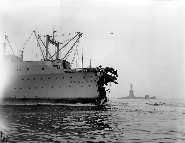 The-Statue-of-Liberty-is-seen-in-the-background-as-the-damaged-Swedish-American-luxury-liner-Stockholm-heads-slowly-through-New-York-Harbor-for-a-safe-berth-July-27-1956-The-passenger-ship-lost-its-bow-and-prow-in-a-collision-with-the-Italian-liner-Andrea-Doria-off-Nantucket-Island-Ma-July-25