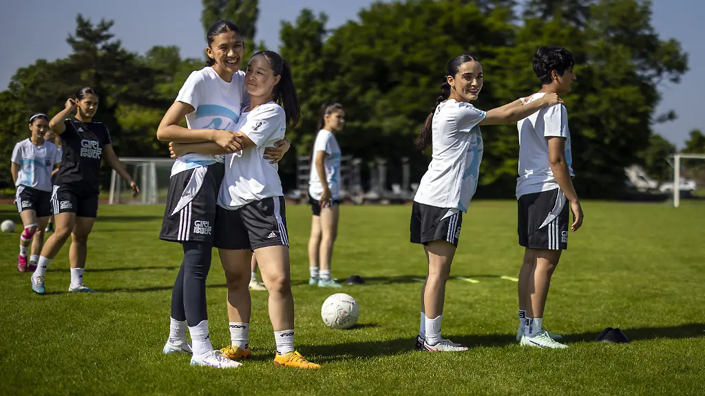 KEYPIX-Young-female-soccer-players-of-Afghanistan-Zahra-Masoma-Omul-Banin-and-Sabreya-left-to-right-attend-a-soccer-training-session-with-the-youngsters-of-VfL-Wolfsburg-GC-Zurich-and-FC-Winterthur-on-Thursday-June-12-2025-in-Zurich-Switzerland-The-United-Summer-Camp-which-runs-until-June-15-is-organized-by-the-Coubertin-meets-Dunant-Foundation-and-brings-together-players-aged-17-to-20-from-Afghanistan-VfL-Wolfsburg-GC-Zurich-and-FC-Winterthur-at-the-camp-The-recognized-refugees-from-Afghanistan-live-and-study-in-various-places-in-Europe