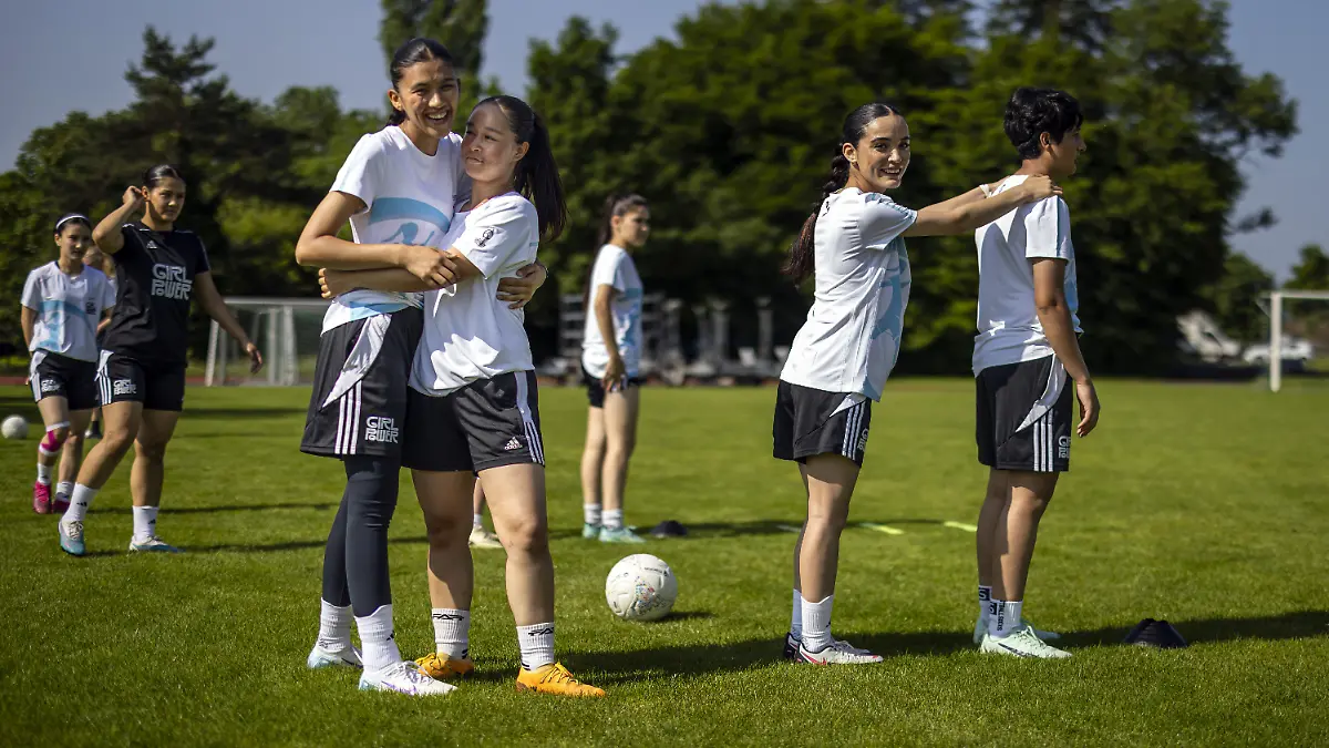 KEYPIX-Young-female-soccer-players-of-Afghanistan-Zahra-Masoma-Omul-Banin-and-Sabreya-left-to-right-attend-a-soccer-training-session-with-the-youngsters-of-VfL-Wolfsburg-GC-Zurich-and-FC-Winterthur-on-Thursday-June-12-2025-in-Zurich-Switzerland-The-United-Summer-Camp-which-runs-until-June-15-is-organized-by-the-Coubertin-meets-Dunant-Foundation-and-brings-together-players-aged-17-to-20-from-Afghanistan-VfL-Wolfsburg-GC-Zurich-and-FC-Winterthur-at-the-camp-The-recognized-refugees-from-Afghanistan-live-and-study-in-various-places-in-Europe