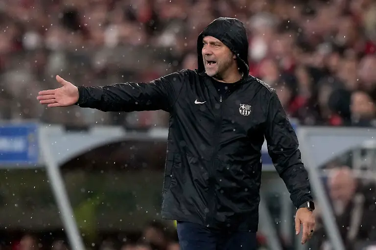 Barcelona-s-head-coach-Hansi-Flick-reacts-during-a-Champions-League-opening-phase-soccer-match-between-SL-Benfica-and-FC-Barcelona-at-the-Luz-stadium-in-Lisbon-Tuesday-Jan-21-2025