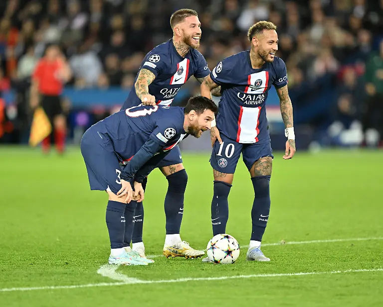 PARIS-FRANCE-OCTOBER-25-Lionel-Messi-L-Sergio-Ramos-C-and-Neymar-R-of-Paris-Saint-Germain-PSG-react-during-the-UEFA-Champions-League-soccer-match-between-Paris-Saint-Germain-and-Maccabi-Haifa-FC-at-Parc-des-Princes-stadium-in-Paris-France-on-October-25-2022