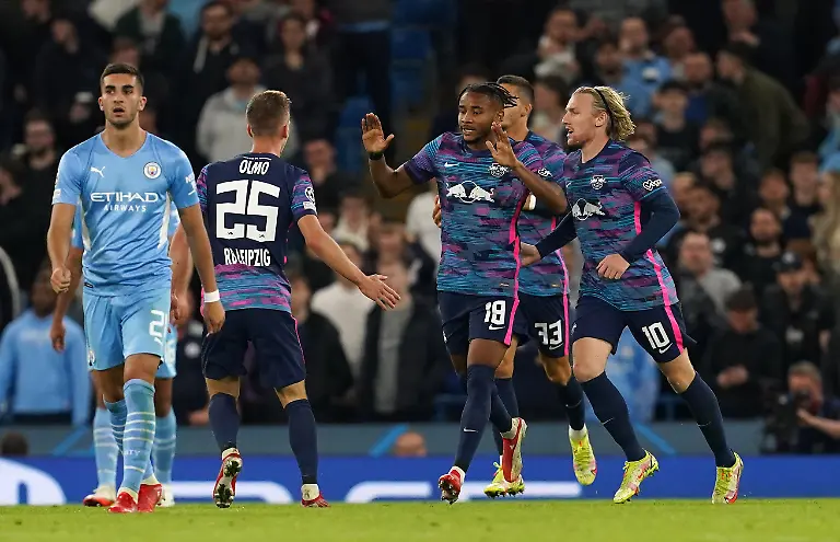 Manchester-City-v-RB-Leipzig-UEFA-Champions-League-Group-A-Etihad-Stadium-RB-Leipzig-s-Christopher-Nkunku-centre-celebrates-with-team-mates-after-scoring-their-side-s-second-goal-of-the-game-during-the-UEFA-Champions-League-Group-A-match-at-the-Etihad-Stadium-Manchester-Picture-date-Wednesday-September-15-2021-See-PA-story-SOCCER-Man-City-Photo-credit-should-read-Martin-Rickett-PA-Wire-RESTRICTIONS-Use-subject-to-restrictions-Editorial-use-only-no-commercial-use-without-prior-consent-from-rights-holder
