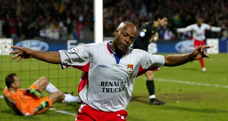epa000385818-Olympique-Lyon-s-Sylvain-Wiltord-celebrates-after-scoring-against-Werder-Bremen-in-their-Champions-League-second-round-football-match-in-Lyon-France-Tuesday-08-March-2005-Lyon-won-7-2