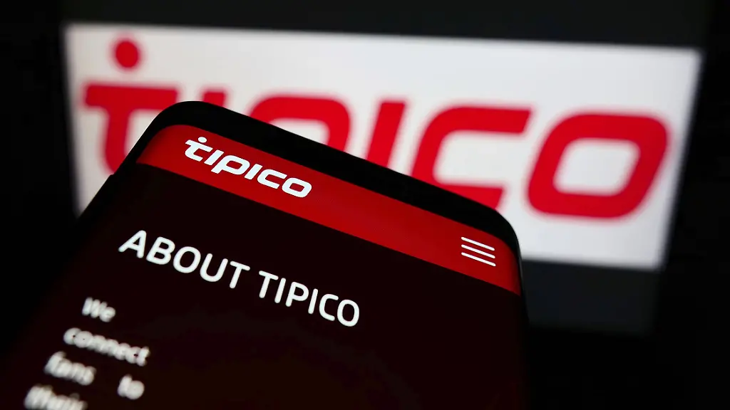 Stuttgart-Germany-01-08-2022-Mobile-phone-with-webpage-of-sports-betting-company-Tipico-Co-Ltd-on-screen-in-front-of-business-logo-Focus-on-top-left-of-phone-display-Europe-Stuttgart-Germany-01-08-2022-Mobile-Phone-With-webpage-of-Sports-Betting-Company-Tipico-Co-Ltd-ON-Screen-in-Front-of-Business-Logo-Focus-ON-Top-left-of-Phone-display-Europe-Copyright-imageBROKER-TimonxSchneider-ibliqx10703476