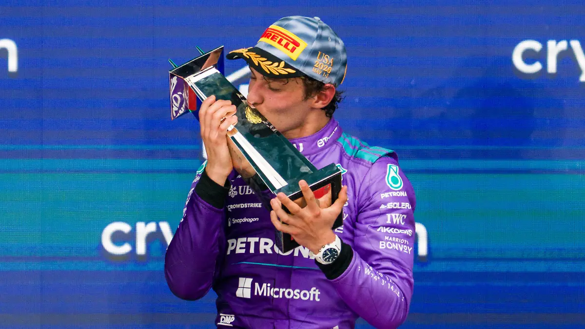 Mercedes-driver-Kimi-Antonelli-of-Italy-kisses-his-trophy-after-winning-the-Miami-Formula-One-Grand-Prix-auto-race-Sunday-May-3-2026-in-Miami-Gardens-Fla