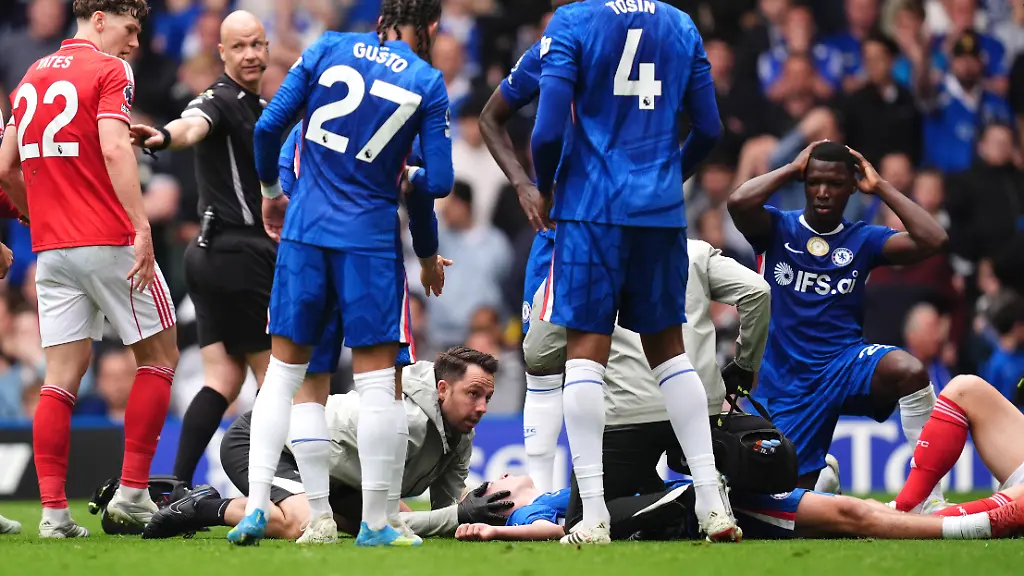 Chelsea-v-Nottingham-Forest-Premier-League-Stamford-Bridge-Chelsea-s-Jesse-Derry-is-treated-by-medical-staff-after-a-clash-of-heads-with-Nottingham-Forest-s-Zach-Abbott-during-the-Premier-League-match-at-Stamford-Bridge-London-Picture-date-Monday-May-4-2026-Photo-credit-should-read-John-Walton-PA-Wire-RESTRICTIONS-EDITORIAL-USE-ONLY-No-use-with-unauthorised-audio-video-data-fixture-lists-club-league-logos-or-live-services-Online-in-match-use-limited-to-120-images-no-video-emulation-No-use-in-betting-games-or-single-club-league-player-publications
