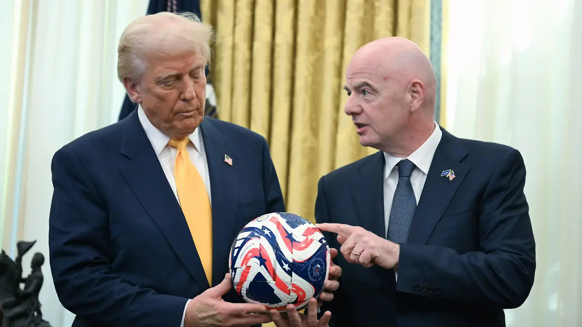 FILE-FIFA-President-Gianni-Infantino-right-presents-President-Donald-Trump-with-the-new-FIFA-Club-World-Cup-official-ball-in-the-Oval-Office-of-the-White-House-in-Washington-March-7-2025