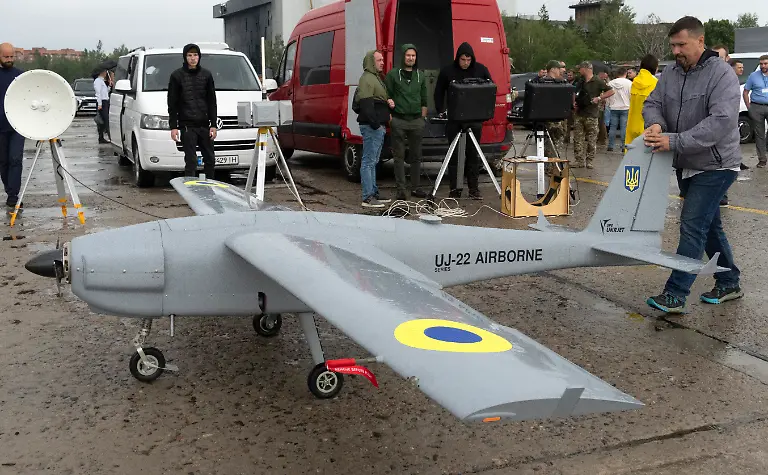 A-man-prepares-to-launch-Ukraine-made-UJ-22-Airborne-a-multi-purpose-unmanned-aerial-system-that-is-able-to-fly-at-any-time-of-day-and-season-in-visual-and-adverse-weather-conditions-in-situation-of-electronic-countermeasures-in-Kyiv-region-Ukraine-Tuesday-Aug-2-2022