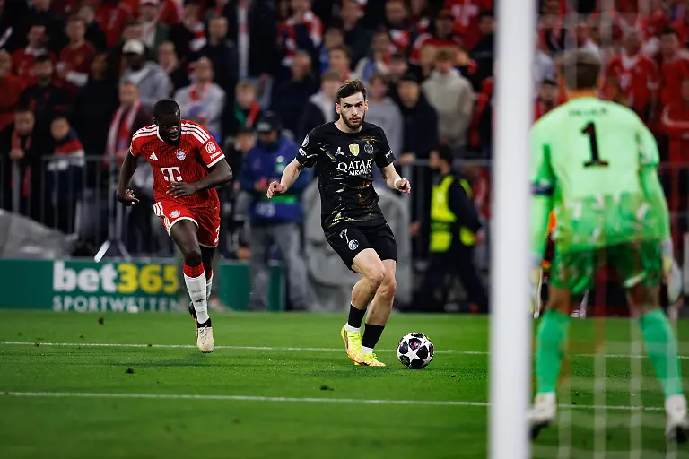Khvicha-Kvaratskhelia-seen-during-UEFA-Champions-League-semifinal-game-between-teams-o-FC-Bayern-Munchen-and-Paris-Saint-Germain-Grzegorz-Wajda-Ball-Raw-Images-Munich-Allianz-Arena-Germany-Copyright-xGrzegorzxWajdax-grzegorzwajda-bayern-psg-2526-4-6