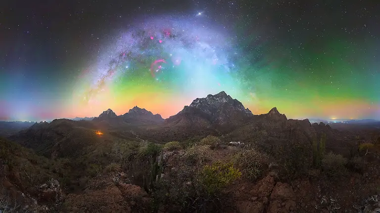 This-photograph-was-captured-in-the-heart-of-the-Sierra-La-Giganta-in-Baja-California-Sur-following-a-two-day-expedition-from-the-small-village-of-San-Juan-Londo-The-final-approach-required-an-ascent-of-more-than-800-meters-by-mule-along-a-long-forgotten-section-of-the-historic-Camino-Real-once-used-by-vaqueros-and-their-donkeys-to-transport-goods-between-remote-settlements-This-path-has-remained-largely-untouched-for-nearly-80-years-The-image-forms-part-of-an-ongoing-project-focused-on-documenting-and-promoting-the-exceptional-dark-skies-of-Baja-California-Sur-for-astrotourism-These-conditions-meet-the-standards-of-true-Dark-Sky-Sanctuaries-offering-some-of-the-purest-night-skies-in-the-region-On-the-right-side-of-the-frame-the-faint-glow-belongs-to-the-distant-city-of-Loreto-the-first-capital-of-the-Californias-located-approximately-30-kilometers-to-the-south-We-were-accompanied-by-Senor-Juan-our-guide-whose-father-first-brought-him-to-this-hidden-location-over-65-years-ago-Together-we-aim-to-preserve-the-memory-of-these-historic-routes-ancient-paths-that-have-been-gradually-reclaimed-by-nature-over-time-This-photograph-reflects-not-only-the-pursuit-of-pristine-dark-skies-but-also-a-deeper-process-of-exploration-and-rediscovery-It-brings-together-the-search-for-untouched-landscapes-with-the-recovery-of-a-cultural-and-historical-legacy-helping-to-position-Baja-California-Sur-as-a-world-class-destination-for-night-sky-photography-while-honoring-the-stories-embedded-in-its-terrain-Milky-Way-photography-goes-beyond-capturing-the-stars-It-becomes-a-way-to-explore-remote-environments-challenge-physical-limits-and-reconnect-with-both-nature-and-history-If-this-image-encourages-others-to-look-beyond-established-paths-in-search-of-truly-dark-skies-then-it-has-fulfilled-its-purpose