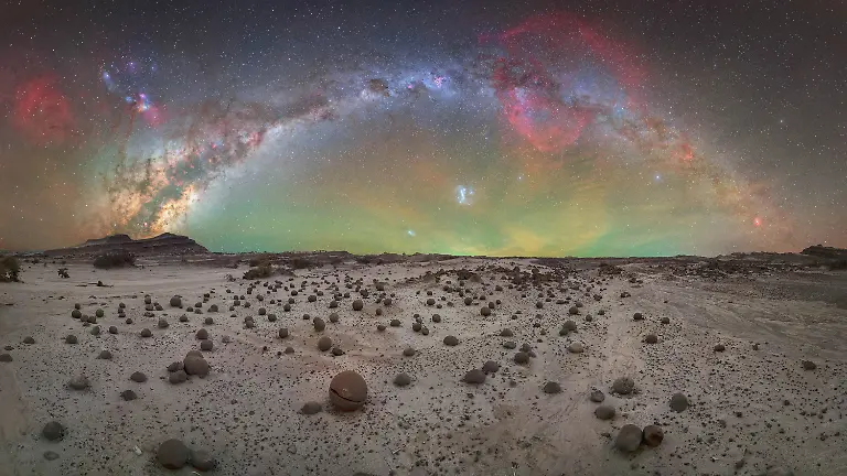 This-photograph-captures-the-first-full-Milky-Way-arch-ever-taken-at-this-location-a-site-of-exceptional-scientific-and-cultural-significance-Recognized-as-a-UNESCO-World-Heritage-Site-its-geological-importance-lies-in-being-the-only-place-on-Earth-where-the-complete-sequence-of-the-Triassic-Period-can-be-observed-preserving-key-fossils-from-the-earliest-dinosaurs-and-earning-its-place-among-the-most-valuable-geological-heritage-sites-in-the-world-Located-in-Valle-Fertil-this-landscape-was-shaped-more-than-200-million-years-ago-by-powerful-river-systems-Today-it-continues-to-attract-geologists-and-paleontologists-from-around-the-globe-further-highlighting-both-its-importance-and-its-fragility-While-photographing-in-the-area-known-as-Cancha-de-Bochas-I-felt-an-unprecedented-sense-of-responsibility-Guided-by-local-experts-accessing-the-site-required-extreme-care-Every-movement-had-to-be-deliberate-to-avoid-damaging-this-irreplaceable-environment-turning-the-experience-into-a-challenge-that-went-far-beyond-the-technical-aspects-of-photography-In-the-end-this-was-not-just-about-capturing-an-image-but-about-connecting-with-the-deep-past-of-our-planet-Places-like-this-remind-us-that-beyond-appreciating-them-we-also-share-the-responsibility-of-preserving-them