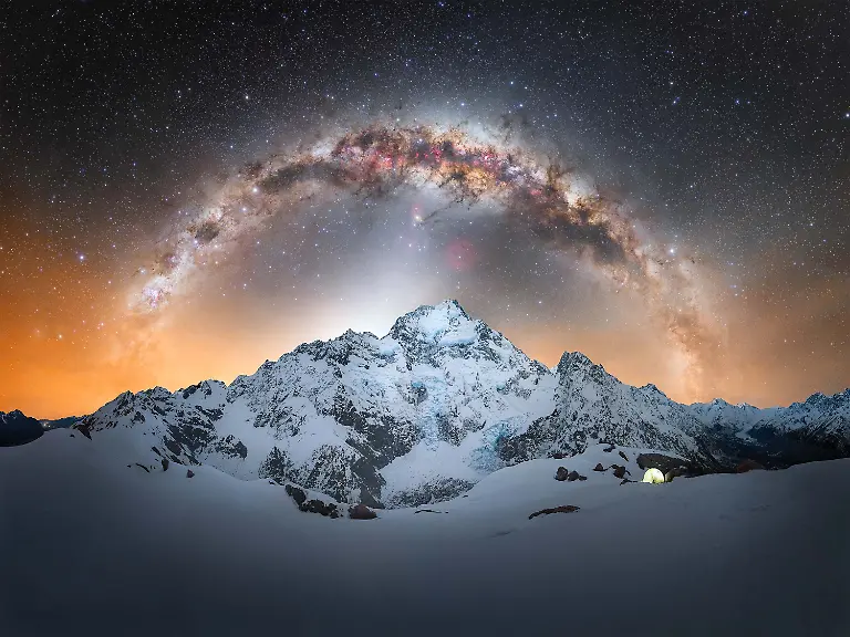 My-goal-with-astrophotography-has-always-been-to-combine-my-passion-for-mountains-adventure-and-the-landscapes-of-New-Zealand-Capturing-the-Milky-Way-arch-above-Aoraki-Mount-Cook-the-central-peak-of-the-national-park-became-one-of-the-most-demanding-challenges-I-had-set-for-myself-Reaching-this-location-required-drawing-on-my-experience-as-a-mountaineer-navigating-steep-rocky-terrain-and-snow-covered-slopes-under-winter-conditions-The-route-presented-constant-challenges-including-large-washouts-along-the-mountainside-unstable-snow-affected-by-solar-radiation-and-the-demands-of-winter-camping-at-altitude-The-effort-required-both-physical-endurance-and-careful-decision-making-throughout-the-journey-Despite-these-difficulties-the-environment-offered-extraordinary-conditions-As-night-fell-the-Milky-Way-and-zodiacal-light-appeared-with-exceptional-clarity-enhanced-by-the-cold-stable-air-at-elevation-Being-positioned-so-close-to-Aoraki-added-a-sense-of-scale-and-intensity-to-the-moment-especially-as-the-western-arc-of-the-Milky-Way-moved-into-alignment-above-the-mountain-With-only-a-brief-window-to-capture-the-scene-there-was-little-margin-for-error-This-image-represents-that-single-opportunity-where-preparation-experience-and-timing-came-together-to-document-a-moment-that-felt-both-challenging-and-deeply-rewarding