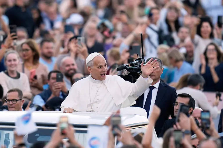 Pope-Leo-XIV-greets-faithful-before-the-start-of-a-Rosary-vigil-for-peace-in-St-Peter-s-Square-on-the-63rd-anniversary-of-the-beginning-of-the-Second-Vatican-Council-at-the-Vatican-Saturday-Oct-12-2025