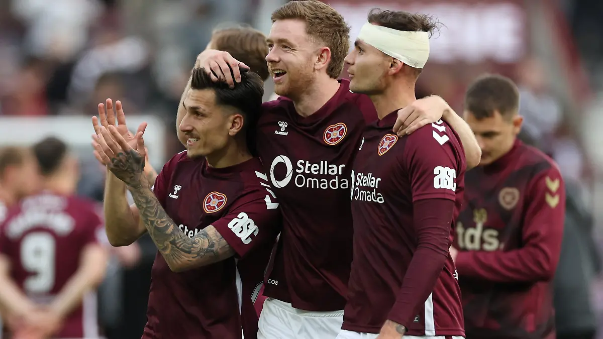 Soccer-Football-Scottish-Premiership-Heart-of-Midlothian-v-Rangers-Tynecastle-Park-Edinburgh-Scotland-Britain-May-4-2026-Heart-of-Midlothian-s-Alexandros-Kyziridis-Stuart-Findlay-and-Michael-Steinwender-celebrate-after-the-match-REUTERS-Russell-Cheyne