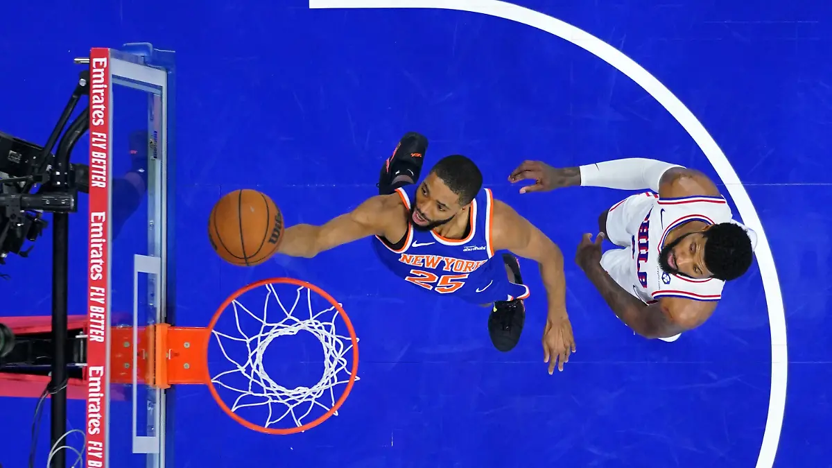 New-York-Knicks-Mikal-Bridges-left-goes-up-for-a-shot-against-Philadelphia-76ers-Paul-George-during-the-second-half-of-Game-3-in-a-second-round-NBA-basketball-playoff-series-Friday-May-8-2026-in-Philadelphia