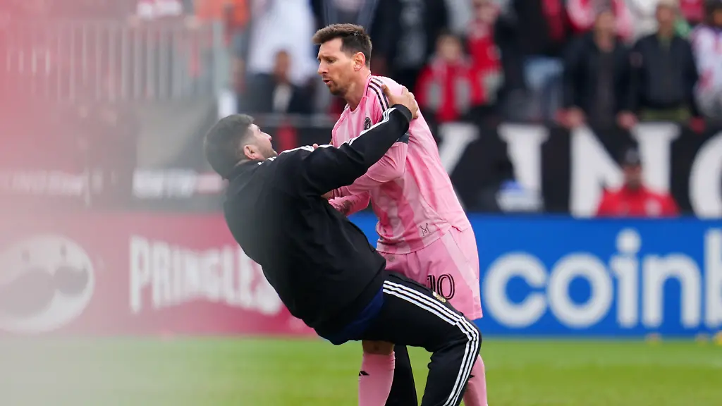 Inter-Miami-CF-midfielder-Lionel-Messi-10-pushes-a-fan-down-after-he-ran-onto-the-pitch-during-second-half-MLS-soccer-against-Toronto-FC-in-Toronto-on-Saturday-May-9-2026