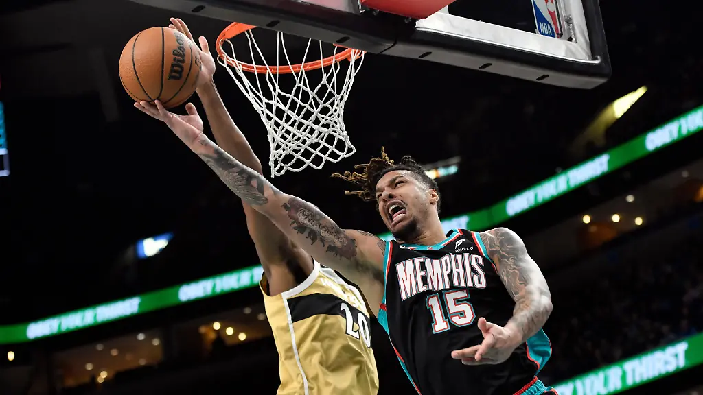 FILE-Memphis-Grizzlies-forward-Brandon-Clarke-15-shoots-against-Washington-Wizards-center-Alex-Sarr-20-in-the-first-half-of-an-NBA-basketball-game-Dec-20-2025-in-Memphis-Tenn
