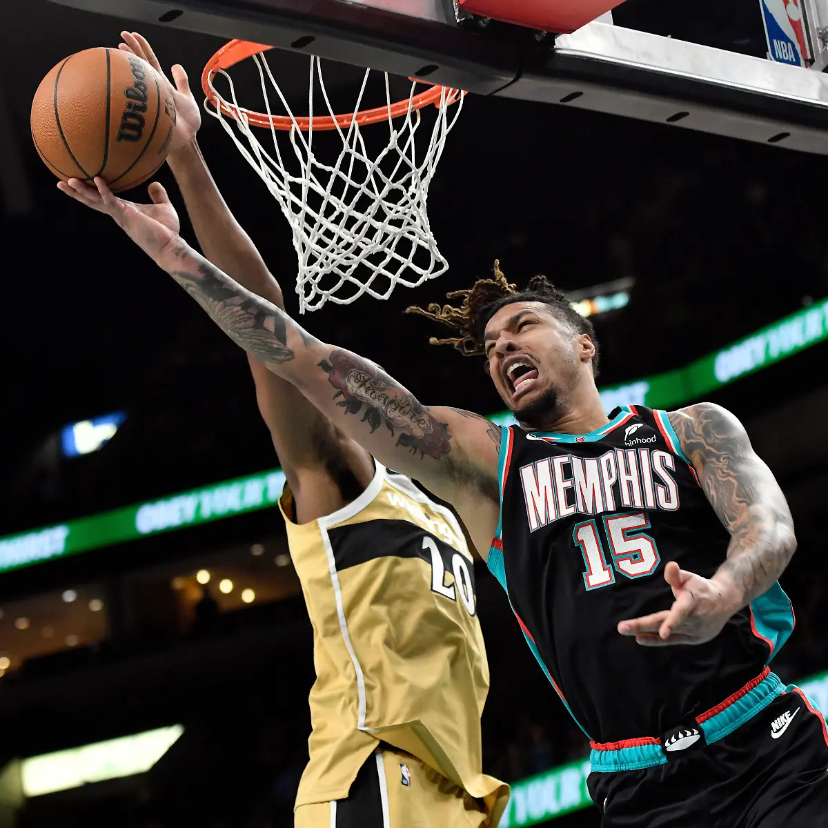 FILE-Memphis-Grizzlies-forward-Brandon-Clarke-15-shoots-against-Washington-Wizards-center-Alex-Sarr-20-in-the-first-half-of-an-NBA-basketball-game-Dec-20-2025-in-Memphis-Tenn