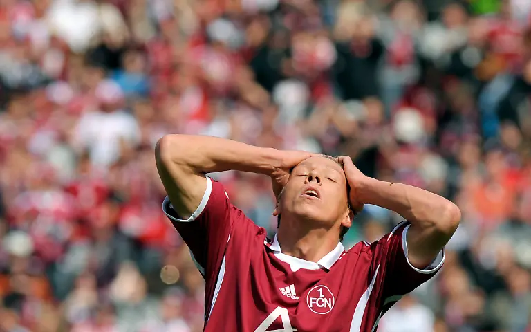 Nuremberg-s-Mike-Frantz-reacts-during-the-German-first-division-Bundesliga-soccer-match-between-1-FC-Nuremberg-and-1-FC-Cologne-in-Nuremberg-southern-Germany-on-Saturday-May-8-2010