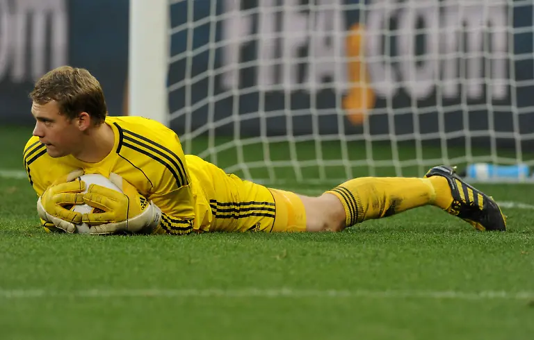 German-goalkeeper-Manuel-Neuer-saves-a-ball-during-the-2010-FIFA-World-Cup-quarterfinal-match-between-Argentina-and-Germany-at-the-Green-Point-Stadium-in-Cape-Town-South-Africa-03-July-2010-Photo-Marcus-Brandt-dpa-Please-refer-to-http-dpaq