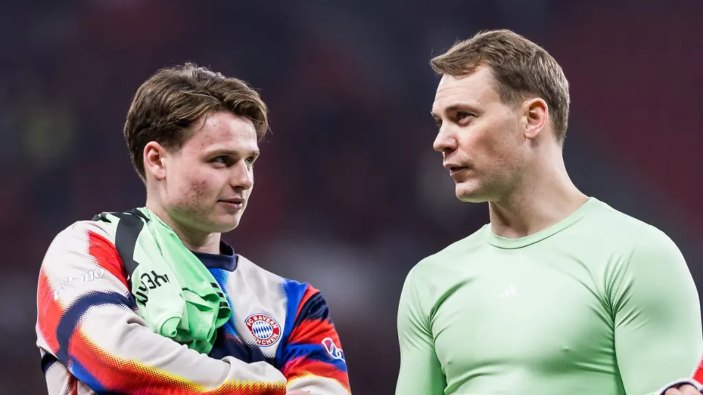 LEVERKUSEN-GERMANY-APRIL-22-Jonas-Urbig-FC-FC-Bayern-Munich-40-and-Manuel-Neuer-FC-FC-Bayern-Munich-1-together-after-winning-the-DFB-Pokal-Semi-final-match-between-Bayer-04-Leverkusen-vs-FC-FC-Bayern-Munich-at-BayArena-during-semi-final-of-the-DFB-Pokal-season-2025-26-on-April-22-2026-in-Leverkusen-Germany