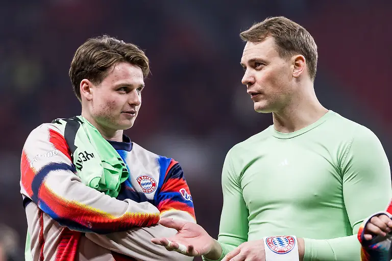 LEVERKUSEN-GERMANY-APRIL-22-Jonas-Urbig-FC-FC-Bayern-Munich-40-and-Manuel-Neuer-FC-FC-Bayern-Munich-1-together-after-winning-the-DFB-Pokal-Semi-final-match-between-Bayer-04-Leverkusen-vs-FC-FC-Bayern-Munich-at-BayArena-during-semi-final-of-the-DFB-Pokal-season-2025-26-on-April-22-2026-in-Leverkusen-Germany