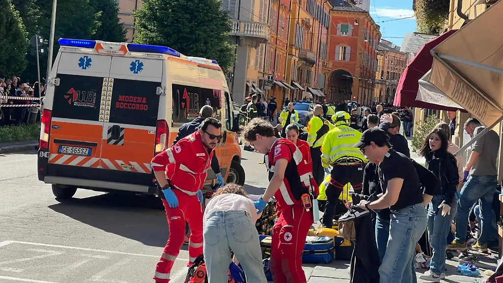 Law-enforcement-and-emergency-workers-respond-after-a-car-plowed-into-a-dozen-pedestrians-in-downtown-Modena-Italy-May-16-2026-Some-people-were-injured-some-seriously