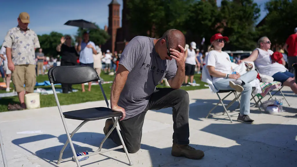 People-pray-as-U-S-House-Speaker-Mike-Johnson-R-LA-not-pictured-leads-a-prayer-at-the-Rededicate-250-A-National-Jubilee-of-Prayer-Praise-Thanksgiving-at-the-National-Mall-in-Washington-D-C-U-S-May-17-2026