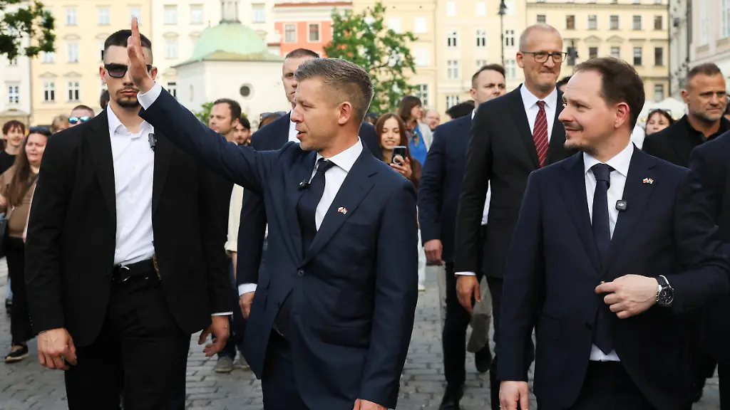 Hungary-s-Prime-Minister-Peter-Magyar-waves-as-he-walks-through-the-Old-Town-during-his-first-official-visit-in-Krakow-Poland-May-19-2026