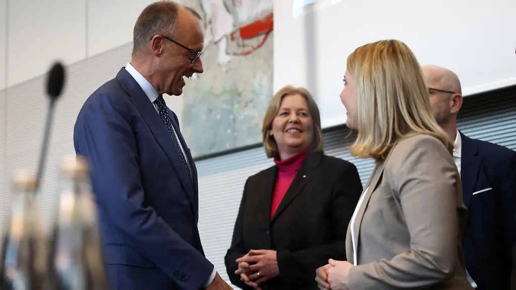 German-Chancellor-Friedrich-Merz-of-the-Christian-Democratic-Union-CDU-Labour-and-Social-Affairs-Minister-Baerbel-Bas-and-Housing-and-Urban-Development-Minister-Verena-Hubertz-attend-a-Social-Democratic-Party-SPD-Bundestag-faction-meeting-in-Berlin-Germany-May-19-2026