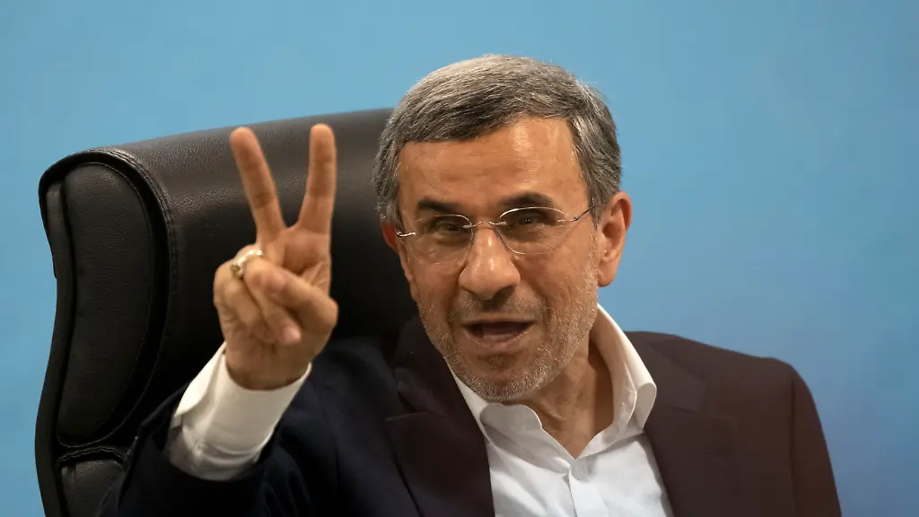 Former-Iranian-President-Mahmoud-Ahmadinejad-is-flashing-a-Victory-sign-while-attending-a-registration-hall-in-the-Iranian-Interior-Ministry-building-for-registering-as-a-Presidential-elections-candidate-during-the-third-day-of-candidates-registration-for-Iran-s-early-Presidential-elections-in-Tehran-Iran-on-June-2-2024