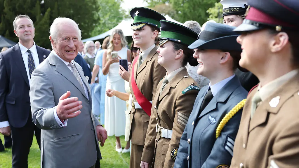 Royal-visit-to-Northern-Ireland-King-Charles-III-laughs-as-he-speaks-with-military-personnel-during-a-Royal-Garden-Party-at-Hillsborough-Castle-on-day-two-of-the-royal-visit-to-Northern-Ireland-Picture-date-Wednesday-May-20-2026