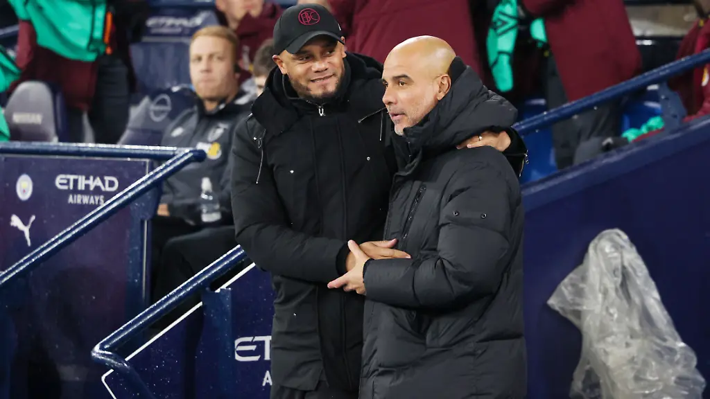 Burnley-Manager-Vincent-Kompany-and-Manchester-City-Manager-Pep-Guardiola-during-the-English-championship-Premier-League-football-match-between-Manchester-City-and-Burnley-on-31-January-2024-at-the-Etihad-Stadium-in-Manchester-England-Photo-Simon-Davies-ProSportsImages-DPPI