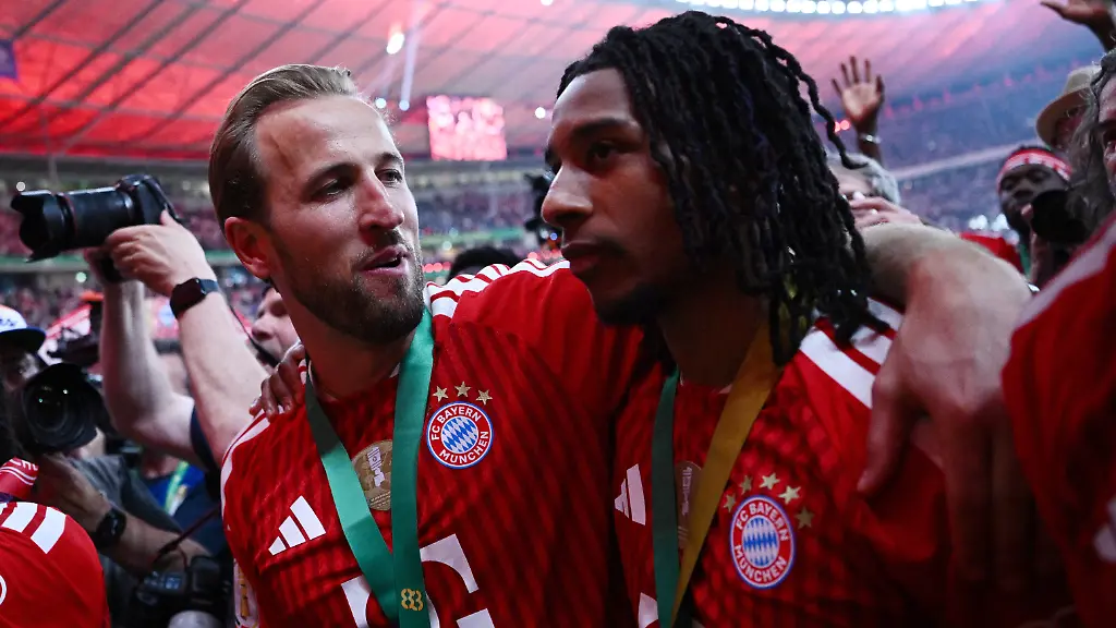 Soccer-Football-DFB-Cup-Final-Bayern-Munich-v-VfB-Stuttgart-Olympiastadion-Berlin-Germany-May-23-2026-Bayern-Munich-s-Harry-Kane-celebrates-with-Michael-Olise-after-winning-the-DFB-Cup-REUTERS-Annegret-Hilse-DFB-REGULATIONS-PROHIBIT-ANY-USE-OF-PHOTOGRAPHS-AS-IMAGE-SEQUENCES-AND-OR-QUASI-VIDEO
