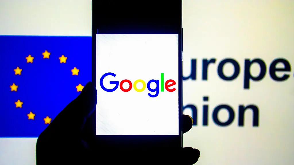 In-this-photo-illustration-a-Google-logo-seen-displayed-on-a-smartphone-with-an-European-Union-logo-in-the-background-Google-s-relationship-with-the-European-Union-EU-has-been-marked-by-regulatory-scrutiny-particularly-around-issues-of-competition-data-privacy-and-digital-market-practices-The-EU-has-fined-Google-multiple-times-for-antitrust-violations-including-practices-related-to-its-search-engine-advertising-business-and-Android-operating-system-totaling-billions-of-euros-The-EU-has-also-imposed-strict-data-privacy-regulations-through-the-General-Data-Protection-Regulation-GDPR-requiring-Google-to-change-its-data-collection-storage-and-usage-practices-In-response-Google-has-had-to-adjust-its-business-models-in-Europe-including-providing-users-with-more-control-over-their-data-and-offering-more-transparency-in-advertising-The-relationship-continues-to-evolve-as-the-EU-introduces-new-regulations-such-as-the-Digital-Markets-Act-DMA-and-the-Digital-Services-Act-DSA-aiming-to-create-a-fairer-and-more-competitive-digital-landscape