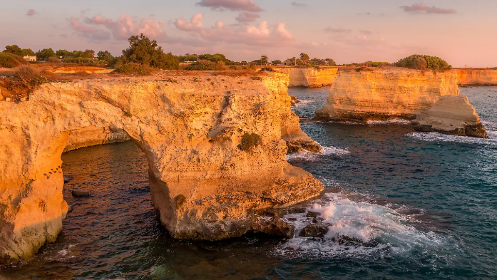 Italy-Santo-Andrea-cliffs-in-Puglia-Meledugno-town-in-Italy-Puglia-Region-Spectacular-view-at-sunrise-on-Santo-Andrea-cliffs-Copyright-xZoonar