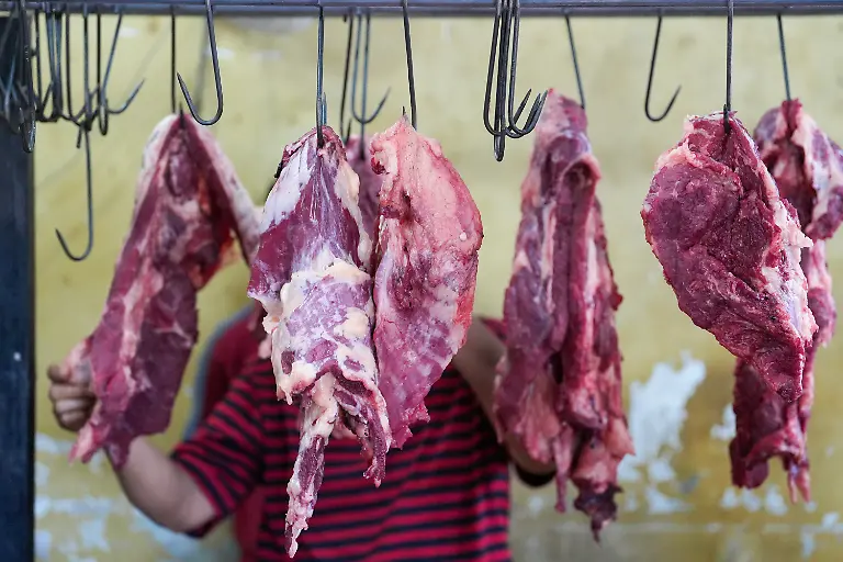 May-26-2026-Banda-Aceh-Aceh-Indonesia-The-atmosphere-at-the-meat-market-during-the-Meugang-tradition-to-celebrate-Eid-al-Adha-in-Banda-Aceh-Aceh-Province-Indonesia-on-Tuesday-Acehnese-people-have-a-tradition-of-cooking-and-eating-meat-goat-beef-or-buffalo-with-their-families-and-sharing-it-with-others-during-Eid-al-Adha-This-tradition-brings-the-market-to-a-bustling-market-with-butchers-and-residents-flock-to-buy-meat-to-cook-This-tradition-is-commonly-known-as-Meugang