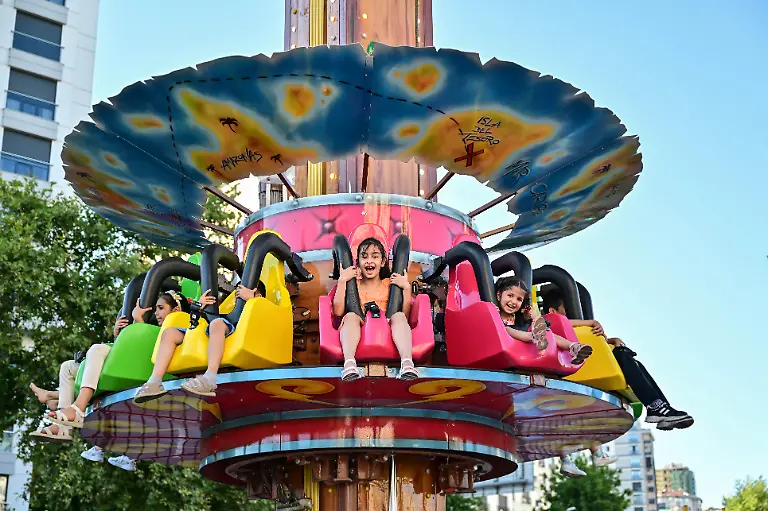 ISTANBUL-TURKIYE-JUNE-16-People-spend-their-Eid-al-Adha-holiday-in-an-amusement-park-at-Bostanci-amusement-park-in-Kadikoy-Istanbul-Turkiye-on-June-16-2024