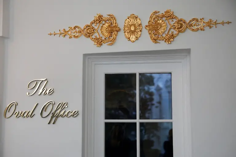 A-new-sign-and-gold-ornamentation-adorn-the-door-of-the-Oval-Office-at-the-White-House-in-Washington-D-C-U-S-January-14-2026