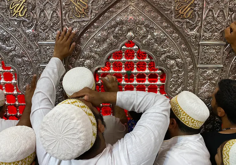 Shiite-Muslim-worshippers-gather-at-the-holy-shrine-of-Imam-Hussein-during-Muharram-processions-in-Karbala-Iraq-Saturday-July-29-2023-Muharram-is-among-the-holiest-months-for-Shiite-Muslims-and-marks-Ashoura-commemorating-the-7th-century-martyrdom-of-the-Prophet-Muhammad-s-grandson-Imam-Hussein
