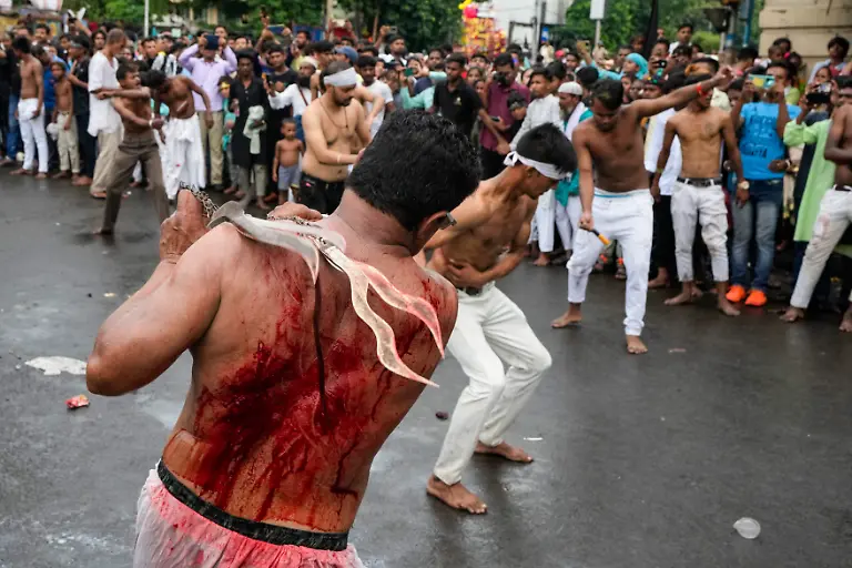 Shiite-Muslims-flagellate-themselves-with-chained-knives-during-a-procession-to-mark-Ashoura-in-Kolkata-India-Saturday-July-29-2023-Ashoura-is-the-tenth-day-of-Muharram-the-first-month-of-the-Islamic-calendar-observed-around-the-world-in-remembrance-of-the-martyrdom-of-Imam-Hussein-the-grandson-of-Prophet-Mohammed