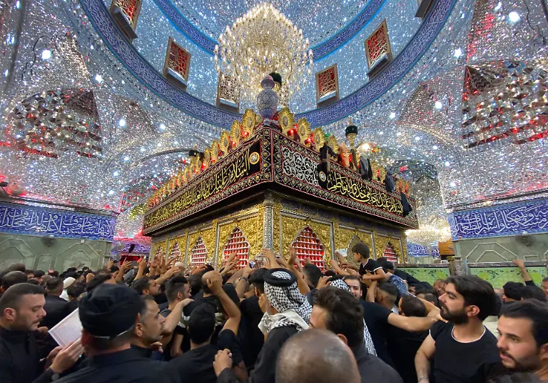 Shiite-worshippers-visit-the-holy-shrine-of-Imam-Abbas-during-Muharram-processions-in-Karbala-Iraq-Saturday-July-29-2023-Muharram-is-among-the-holiest-months-for-Shiite-Muslims-and-marks-Ashoura-commemorating-the-7th-century-martyrdom-of-the-Prophet-Muhammad-s-grandson-Imam-Hussein