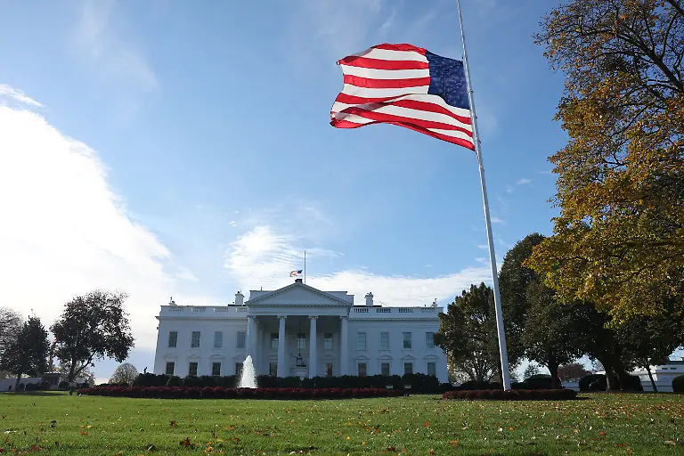 A-large-American-flag-flies-on-the-north-lawn-of-the-White-House-in-Washington-D-C-U-S-November-11-2025