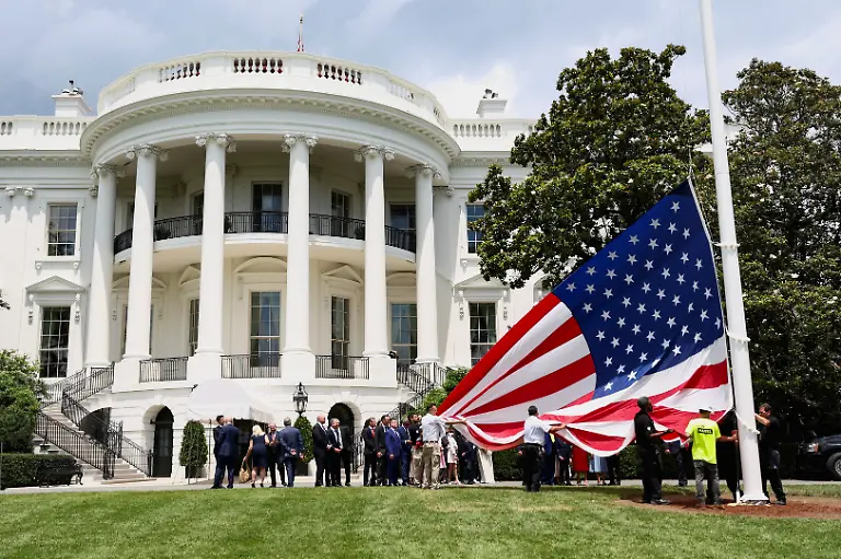 A-U-S-flag-is-prepared-to-be-raised-on-a-new-flagpole-installed-on-the-South-Lawn-of-the-White-House-in-Washington-D-C-U-S-June-18-2025